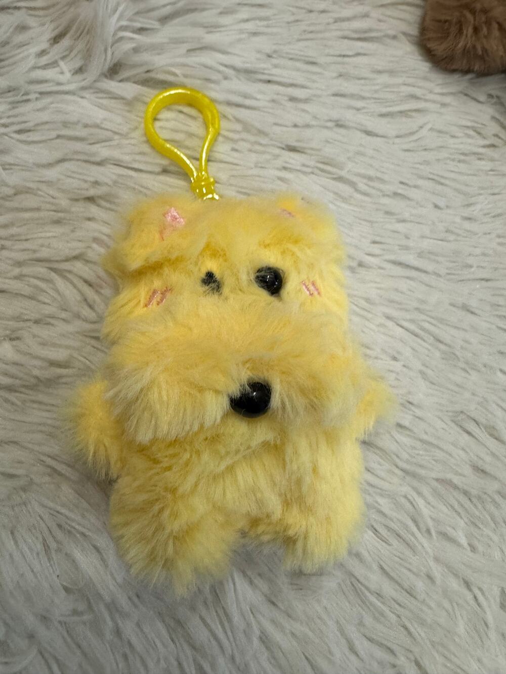 Yellow fluffy dog keychain bag charm with pink ears and black eyes